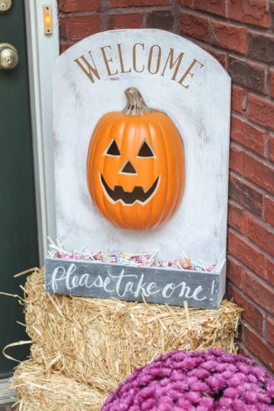 This adorable DIY Lighted Pumpkin Candy Holder is simple to make with just 2 supplies and a few regular household tools! Perfect for leaving behind while you take your kids trick-or-treating!!