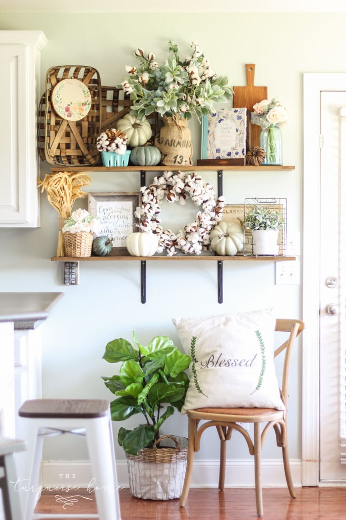 Gorgeous fall farmhouse kitchen shelves with blue, green and blush decor!