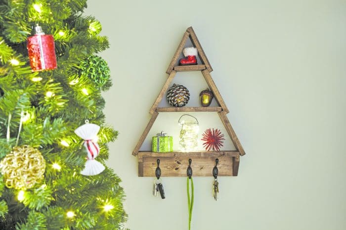 Learn how to make this wonderful Christmas Tree Shelf and put your own spin on this super cute decor. Perfect for the holidays!