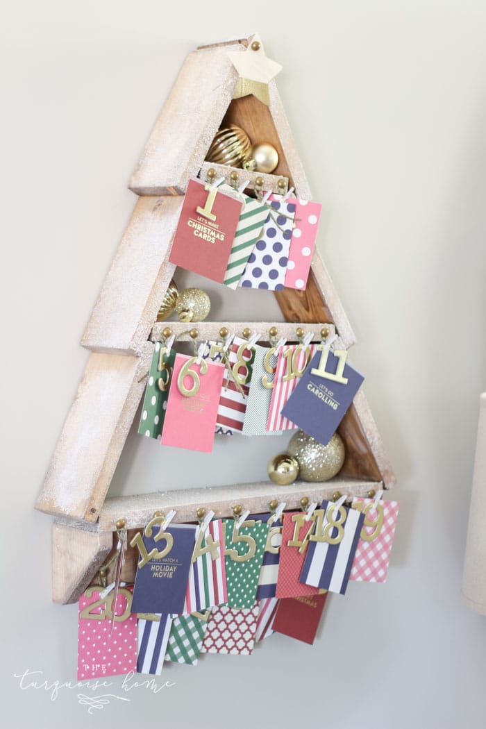 The most adorable DIY snowy Christmas Tree Shelf lends itself to the perfect spot for an advent calendar. LOVE it!!