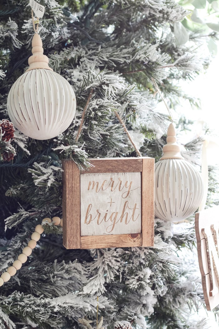 Create a simple wooden sign with a cute saying and create a rustic, farmhouse Christmas look for cheap!