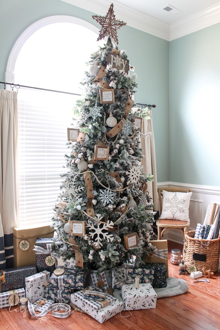 My Flocked Farmhouse Christmas Tree - super cute cotton stems, lamb's ear, galvanized snowflakes, and wooden bead garland.