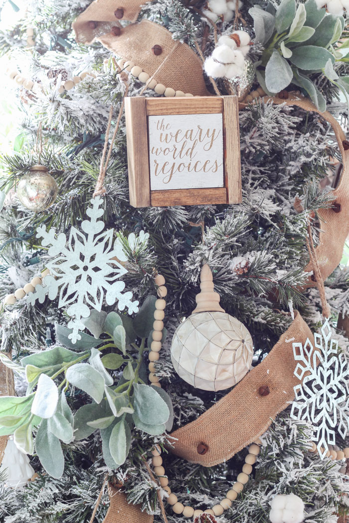 My Flocked Farmhouse Christmas Tree - super cute cotton stems, lamb's ear, galvanized snowflakes, and wooden bead garland.