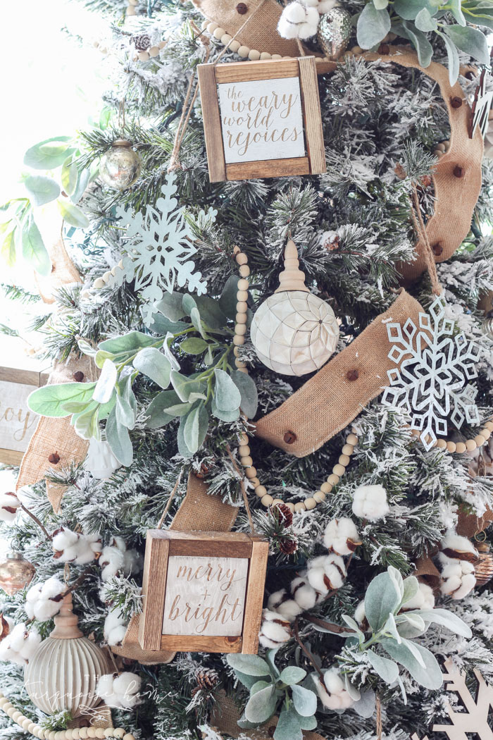 My Flocked Farmhouse Christmas Tree - super cute cotton stems, lamb's ear, galvanized snowflakes, and wooden bead garland.