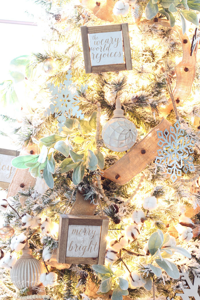 My Flocked Farmhouse Christmas Tree - super cute cotton stems, lamb's ear, galvanized snowflakes, and wooden bead garland.