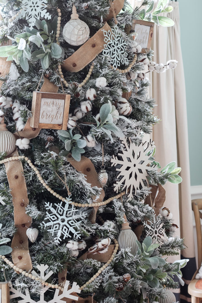 My Flocked Farmhouse Christmas Tree - super cute cotton stems, lamb's ear, galvanized snowflakes, and wooden bead garland.