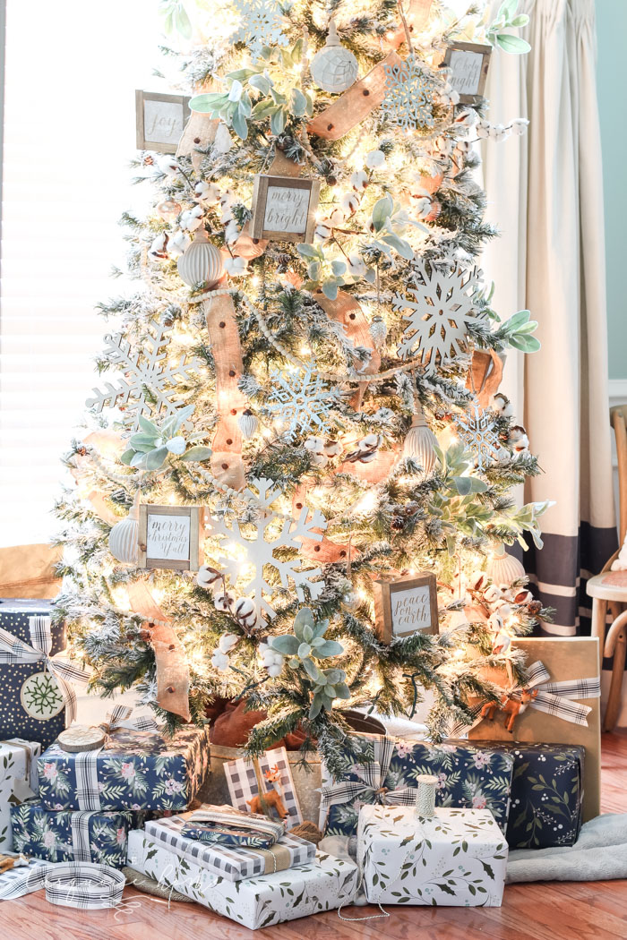 My Flocked Farmhouse Christmas Tree - super cute cotton stems, lamb's ear, galvanized snowflakes, and wooden bead garland.