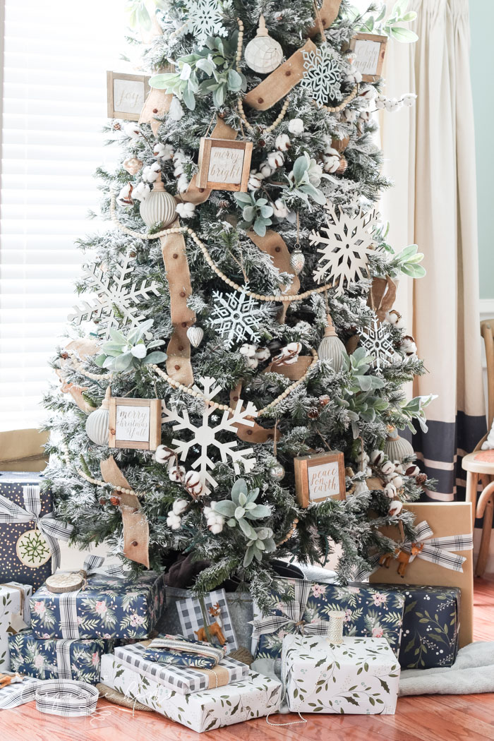 My Flocked Farmhouse Christmas Tree - super cute cotton stems, lamb's ear, galvanized snowflakes, and wooden bead garland.