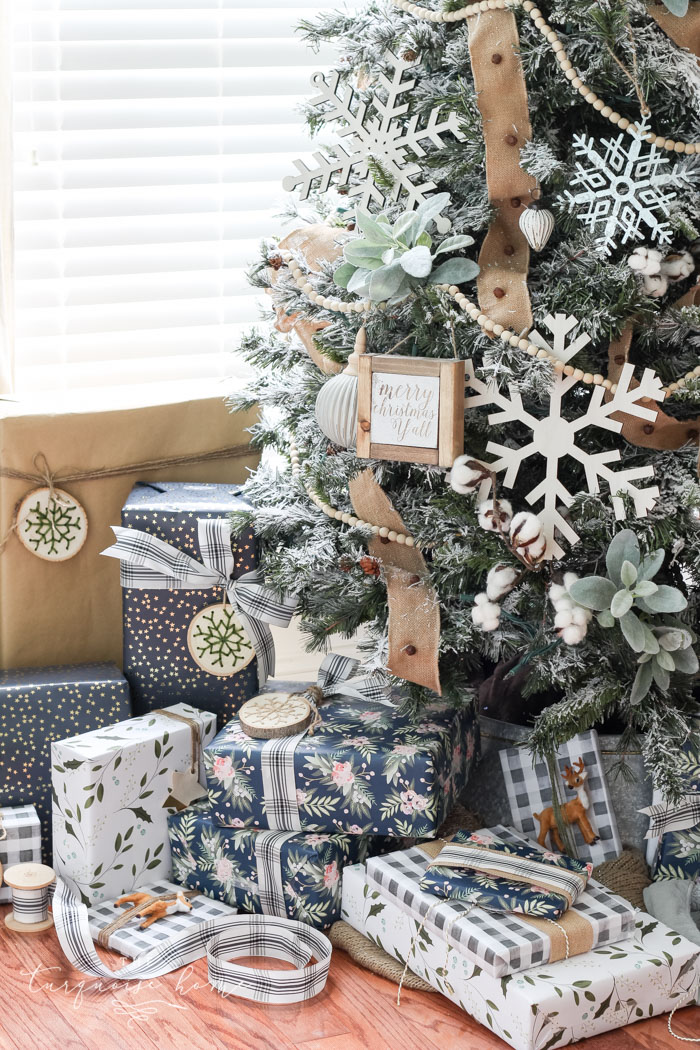 My Flocked Farmhouse Christmas Tree - super cute cotton stems, lamb's ear, galvanized snowflakes, and wooden bead garland.