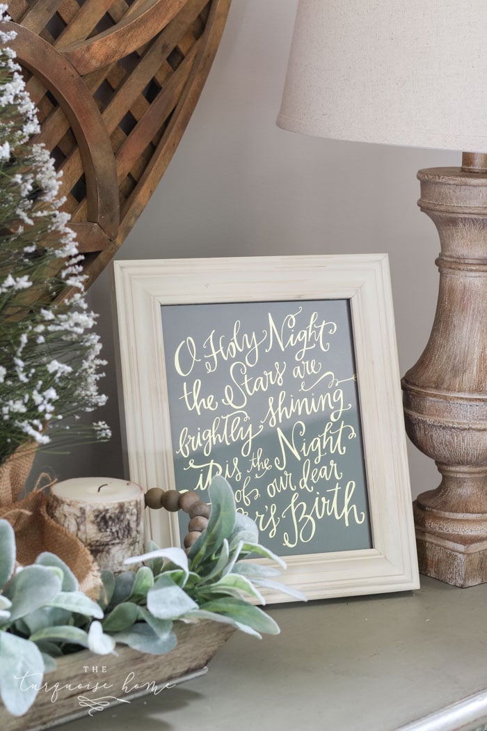 O Holy Night art adds just enough holiday decor to this space! A neutral Christmas entry way - not too fussy or fancy!