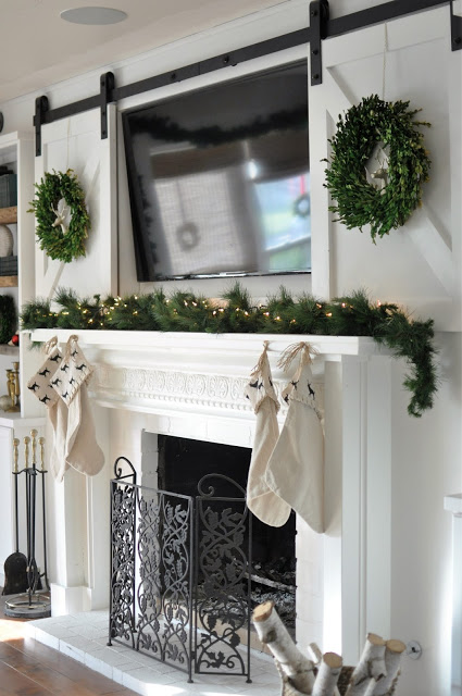 Use a farmhouse sliding barn door to cover the TV!