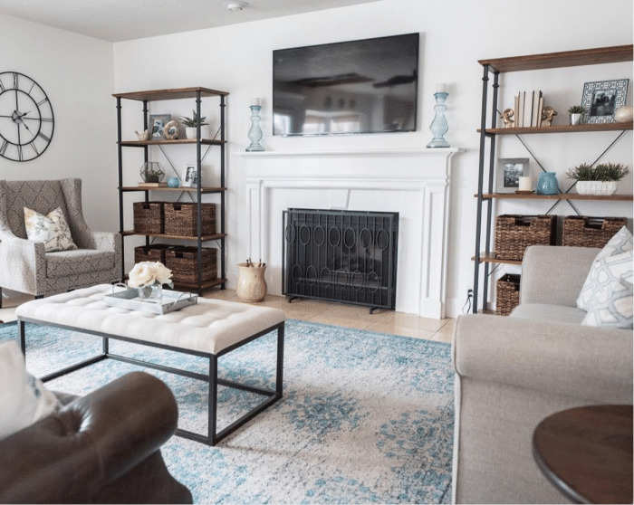 Pretty Mantel flanked with bookshelves and TV