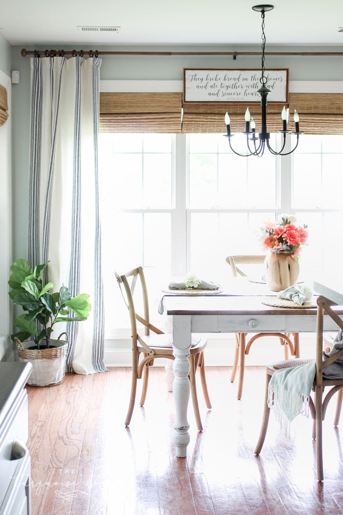 Gorgeous new bamboo shades and striped curtains make an impact in DIY kitchen makeovers! | Kitchen Before and After | Kitchen Makeover Ideas | DIY Kitchen Makeover | Kitchen Remodel Before and After