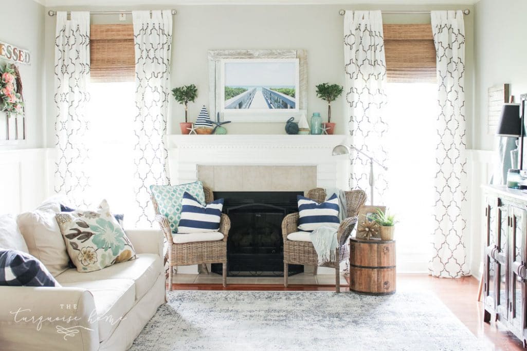 A coastal summer mantel decor ideas. Add a little nautical charm to your living space with these simple coastal summer mantel decor ideas. Featuring DIY beach canvas art, blue & white starfish, textured sailor's knot and cheerfully striped sail boats, this mantel looks great for the seasonally inspired.