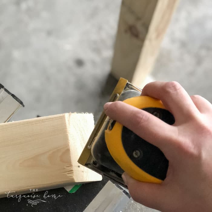 Sand down the whole DIY Coat Rack to make sure there are no splinters or rough spots! Then wipe down with a damp cloth. | Standing Coat Rack | #buildyourownathome #diyproject #diy #buildlikeagirl