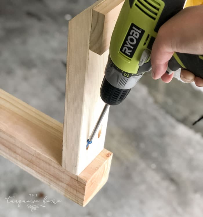 Add the legs to the end of the post with Kreg Jig Screws! #buildyourownathome #diyproject #diy #buildlikeagirl