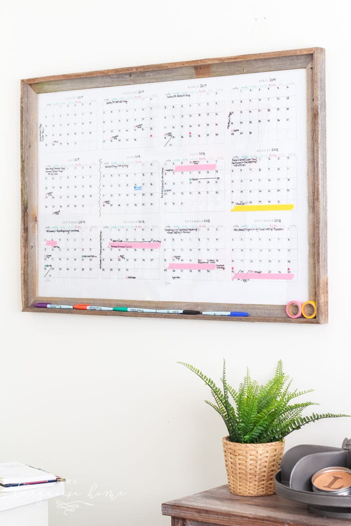 Make your own dry erase calendar board with only 2 steps! Includes a free printable yearly calendar!