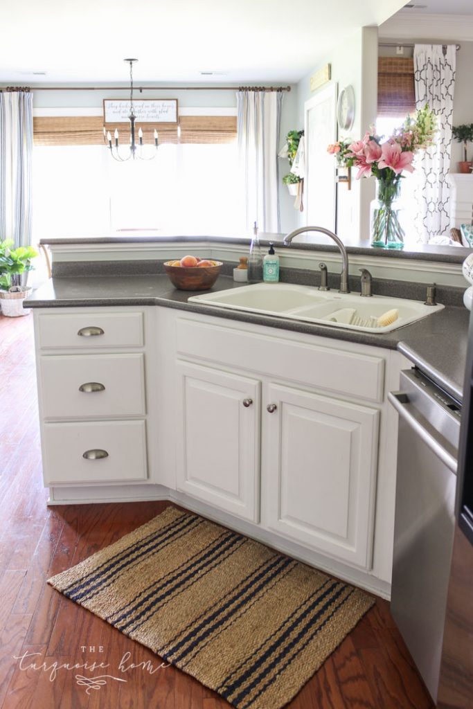 The new jute and navy striped rug is my favorite! Love the hardware too. Summer Home Tour in the Kitchen