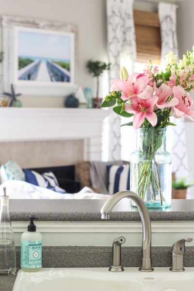 Coastal Summer Home Decor Ideas with fresh flowers and adorable mint Mrs. Meyer's Hand Soap. 😜