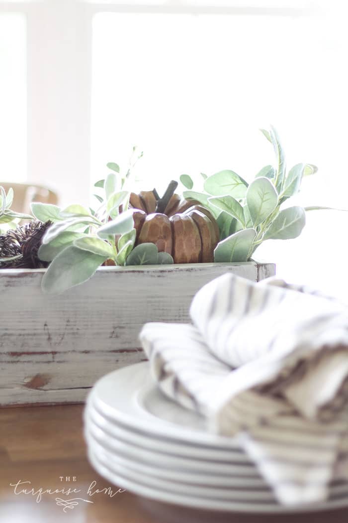 My favorite wooden pumpkin sitting in a bed of lamb's ear leaves. Perfect for a fall centerpiece!