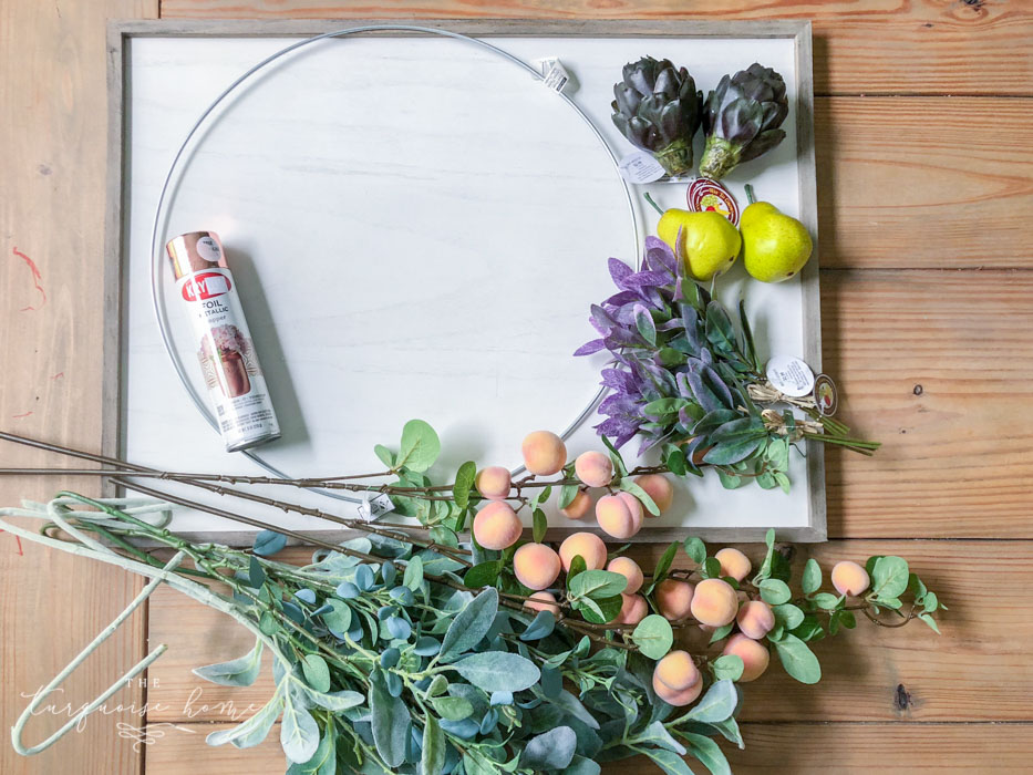 Gather the supplies for your fall wreath with faux fruit!