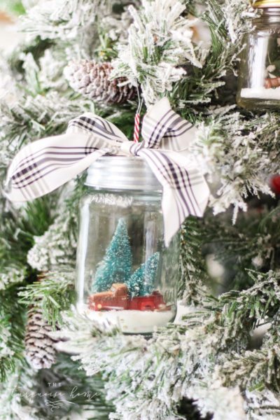 DIY Mason Jar Snow Globe Ornaments - the cutest little ornament you ever did see! #diy #christmasornament