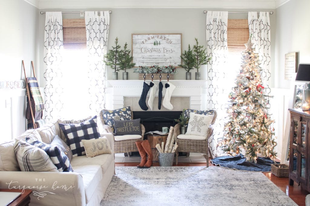 Farmhouse-style living room with flocked Christmas tree.