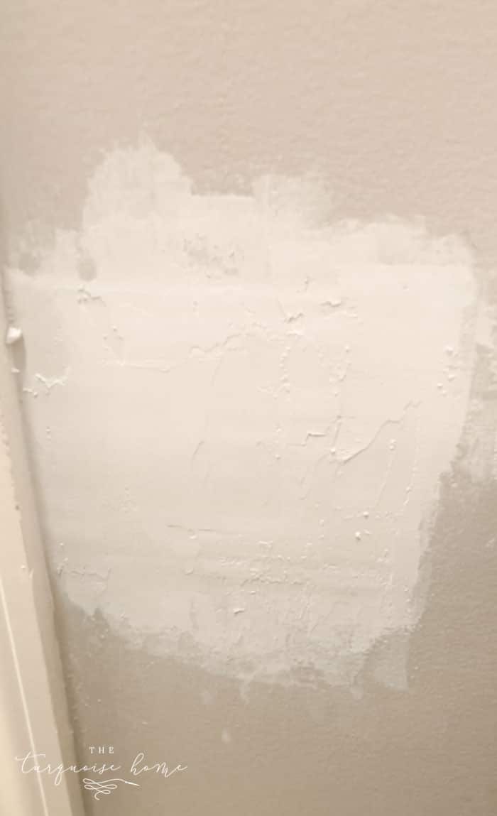 Sanding store drywall patch