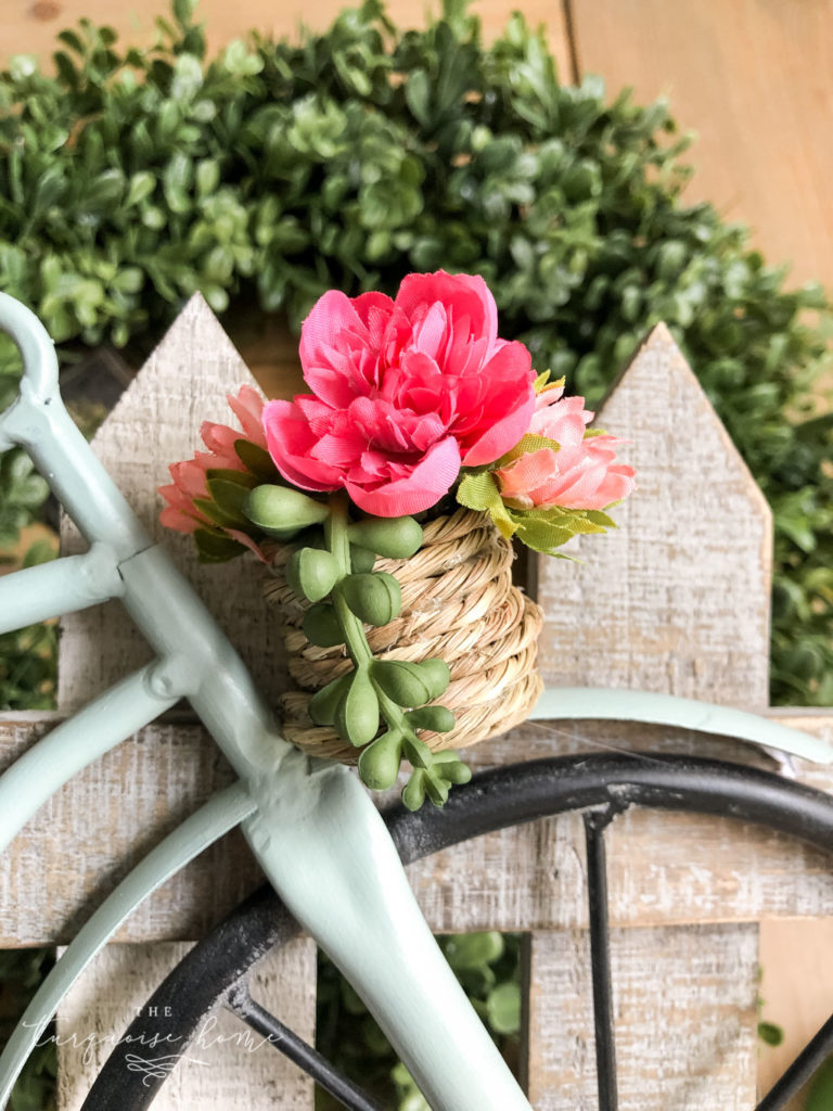 DIY Boxwood and Bicycle Spring Wreath - adding flowers to the basket