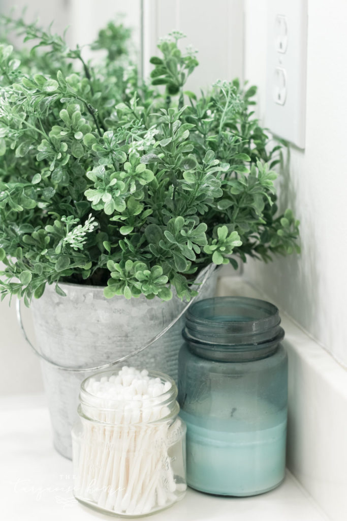 How to Create Big Style in a Small Bathroom | The Girls' Bathroom Refresh Reveal | Boxwood in a Galvanized Bucket | Antique Candles 