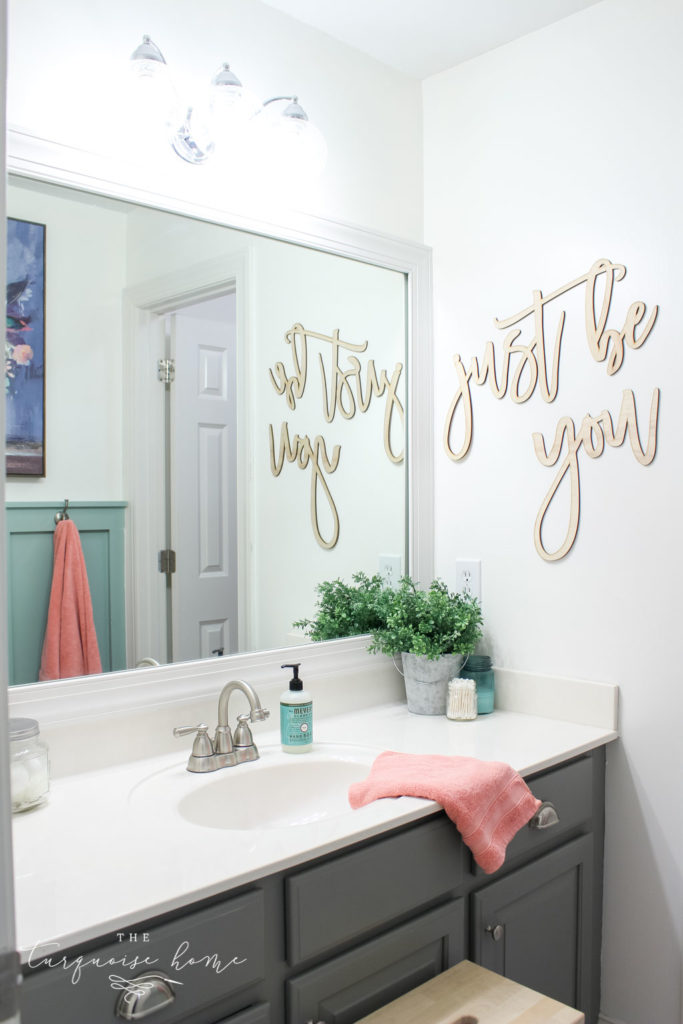 Window arch above the toilet in the girls' bathroom refresh | Use a basket for toilet paper storage and a over-the-toilet cabinet if needed | bathroom makeover