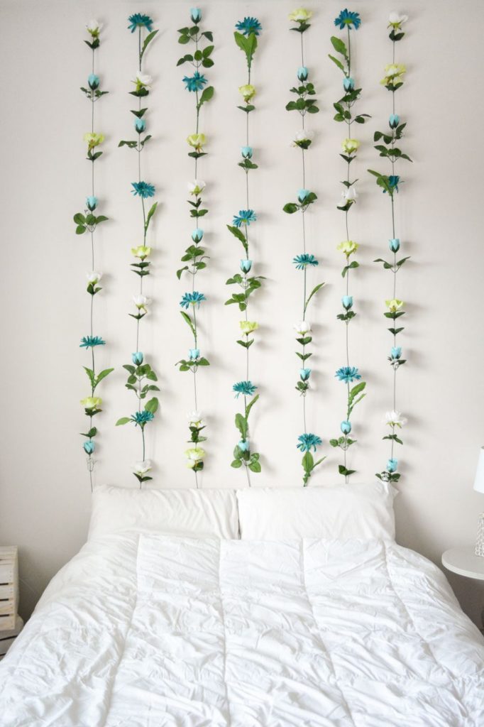 How to make a headboard: 13 Beautiful DIY Headboard Ideas - Make a quick headboard from handing flowers from the ceiling!