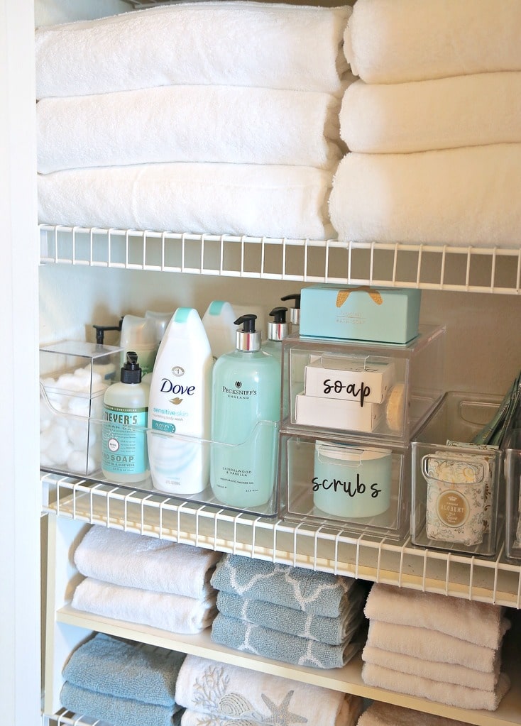 The Creativity Exchange did a fantastic job putting together an organized linen closet. To make your linen closet look this nice, you'll need a lidded plastic bin as well as some bins without lids. And those labels are so cute!
