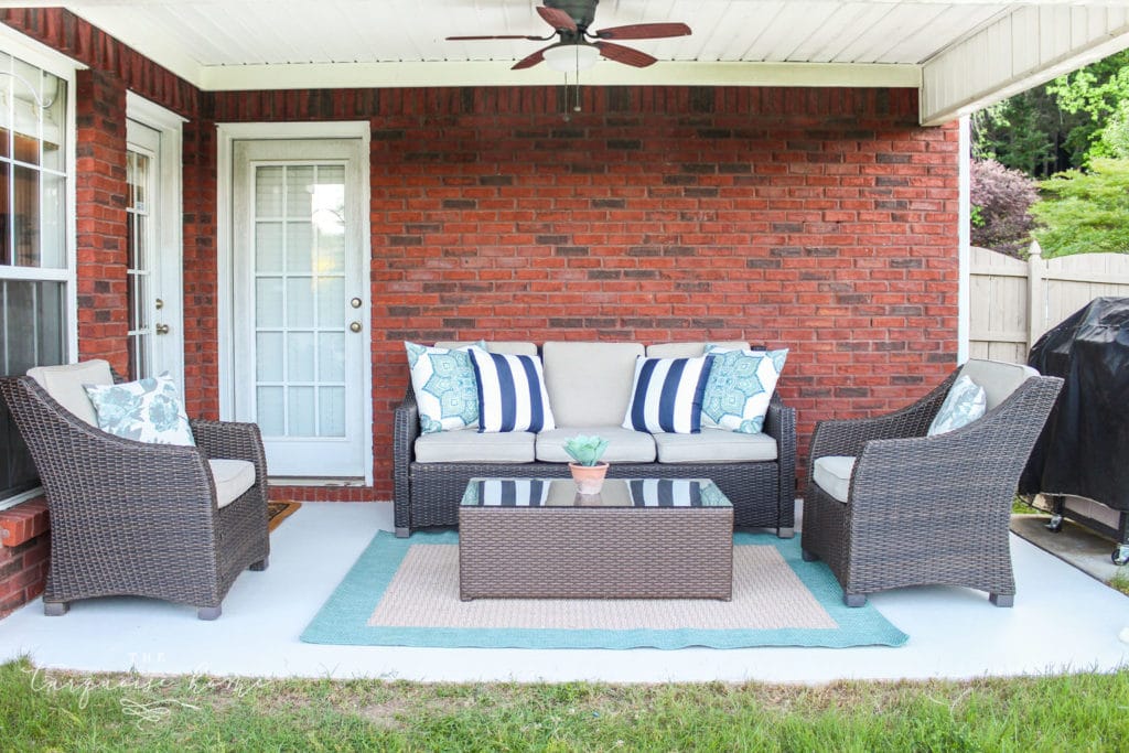 How to Paint a Concrete Patio - with full chairs and rug in it after it was painted