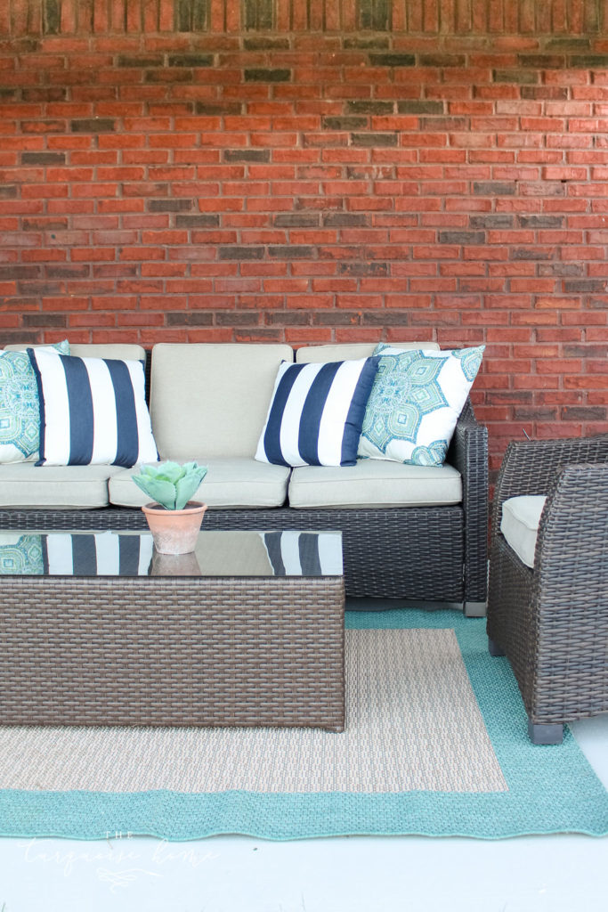 How to Paint a Concrete Patio - with full chairs and rug in it after it was painted