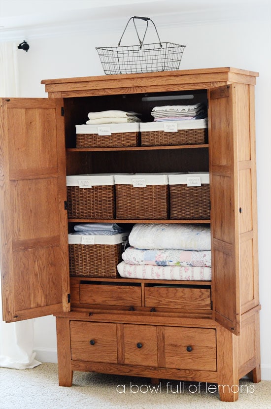 Top Linen Organization tips from A Bowl Full of Lemons | large armoire used as a linen closet