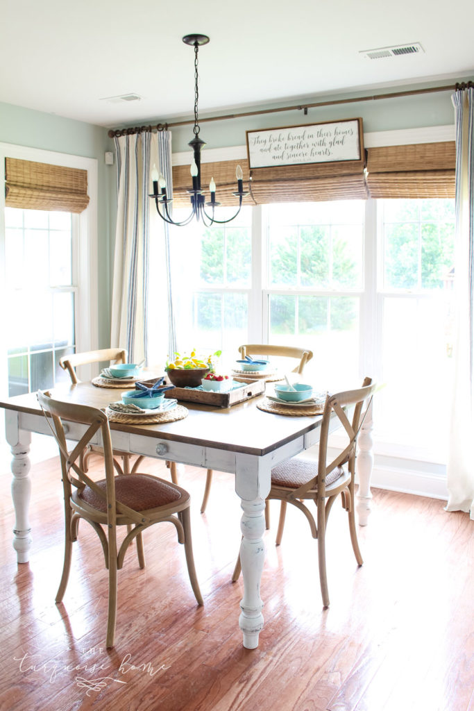 Eat-in Summer Kitchen with red/brown engineered hardwood floors. 