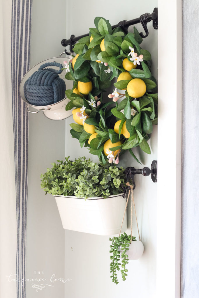 Simple Summer Kitchen Tour with a lemon wreath, white colander and summer greenery