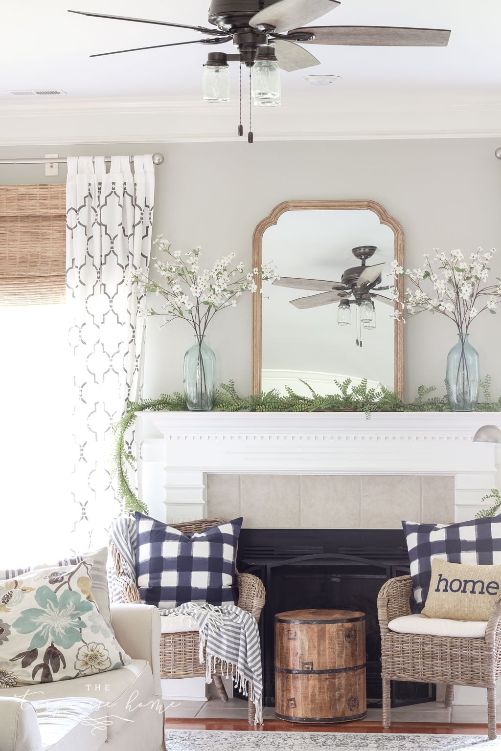 A Simple Summer Mantel -->> wood frame, white mantel, plaid navy pillows, jute bamboo blinds