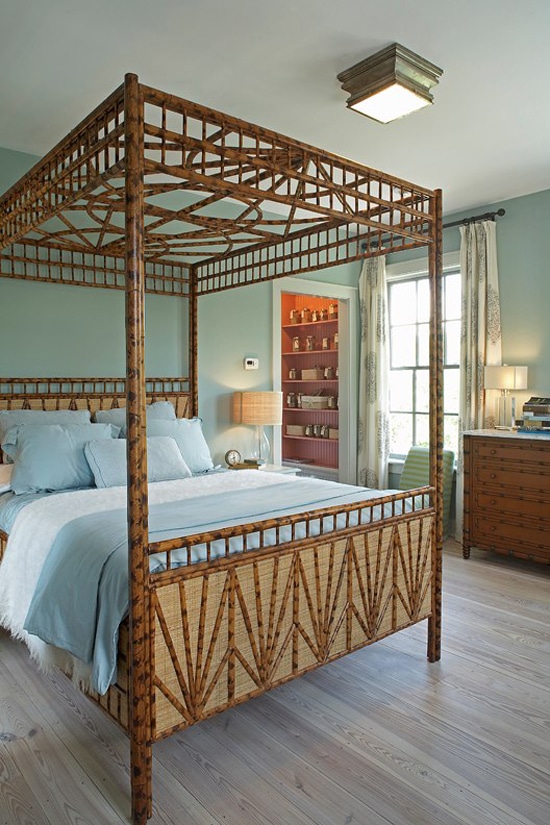 Gorgeous bedroom with Wythe Blue painted walls and a wooden bed.