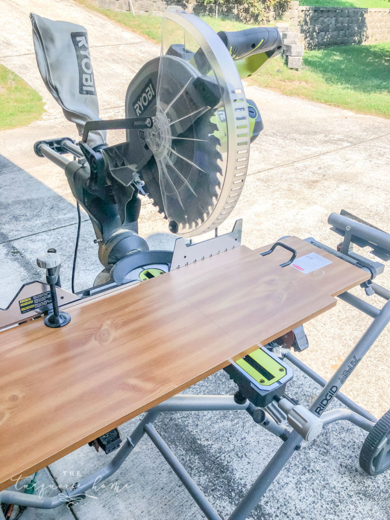 Use a sliding miter saw to cut the boards down for the shelves in the pantry. 