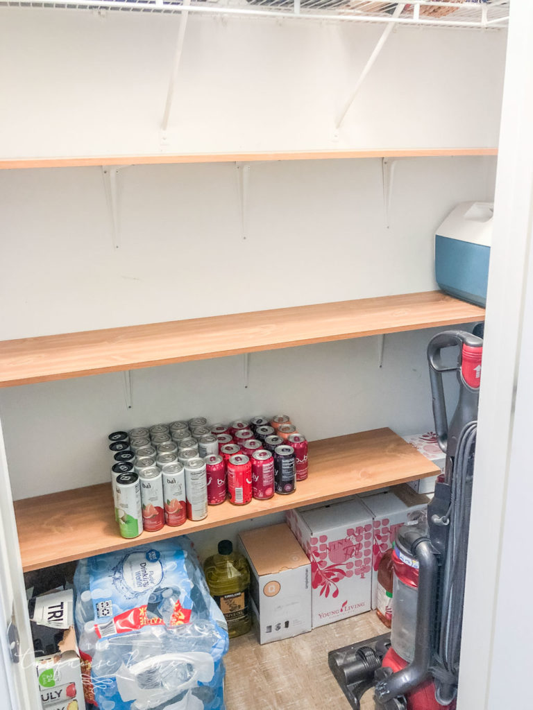 Make a pantry out of unused space in a coat closet by utilizing the vertical space. 