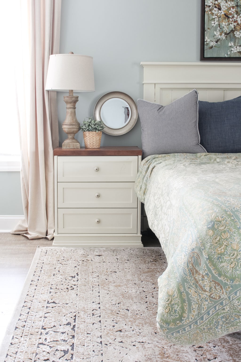 Gorgeous Ivory and Beige Antique-style Rug in a Farmhouse Master Bedroom. What size rug to buy for a king bed?