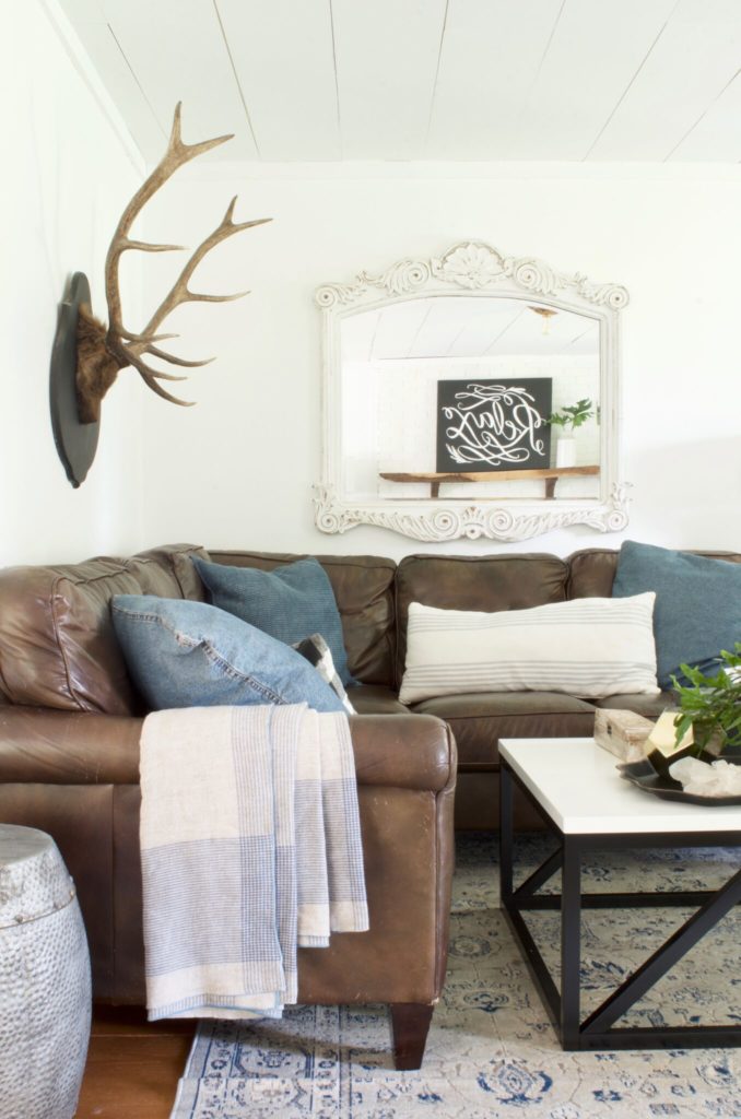 How to Decorate a Living Room - mirror behind the sofa