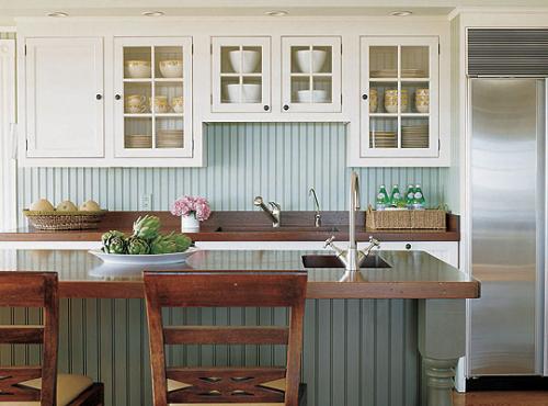 wythe blue beadboard backsplash in a kitchen with white cabinets.