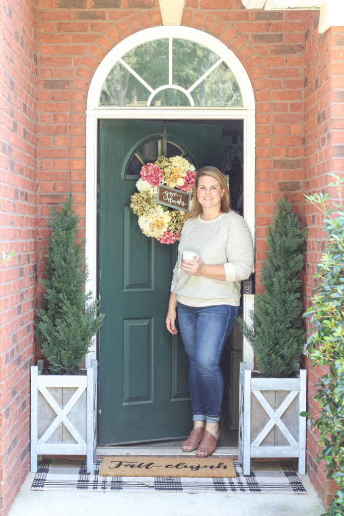 Cozy fall home tour with simple decor ideas for anyone on any budget! Hydrangea wreath, tall evergreen topiaries, fall-elujah doormat.