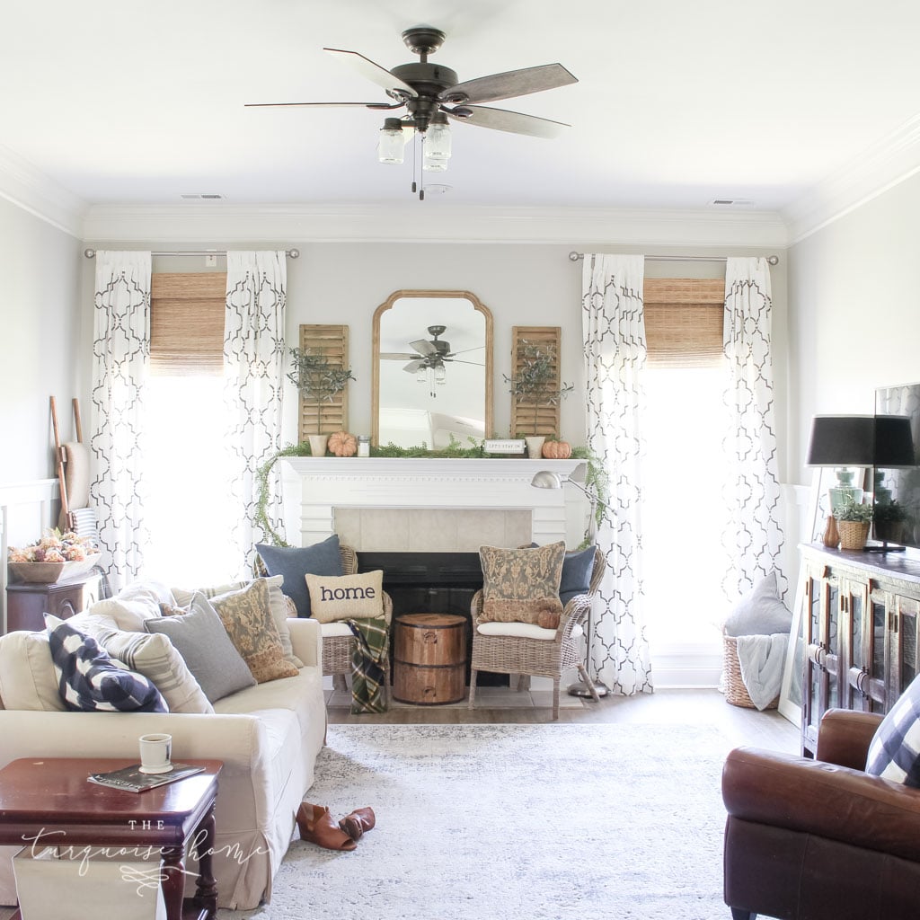 Beautiful blues and browns in this fall decorated living room. | Fall Mantel Decor Ideas | Fall Decor