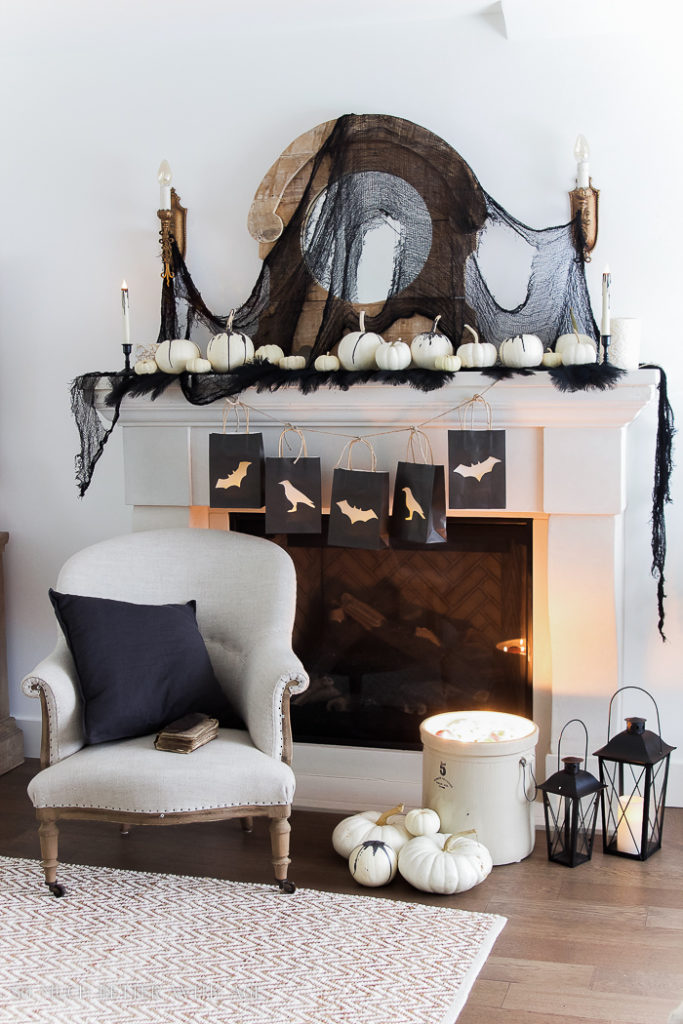 Classic black and white touches make this Halloween mantel decor super affordable and easy to achieve!