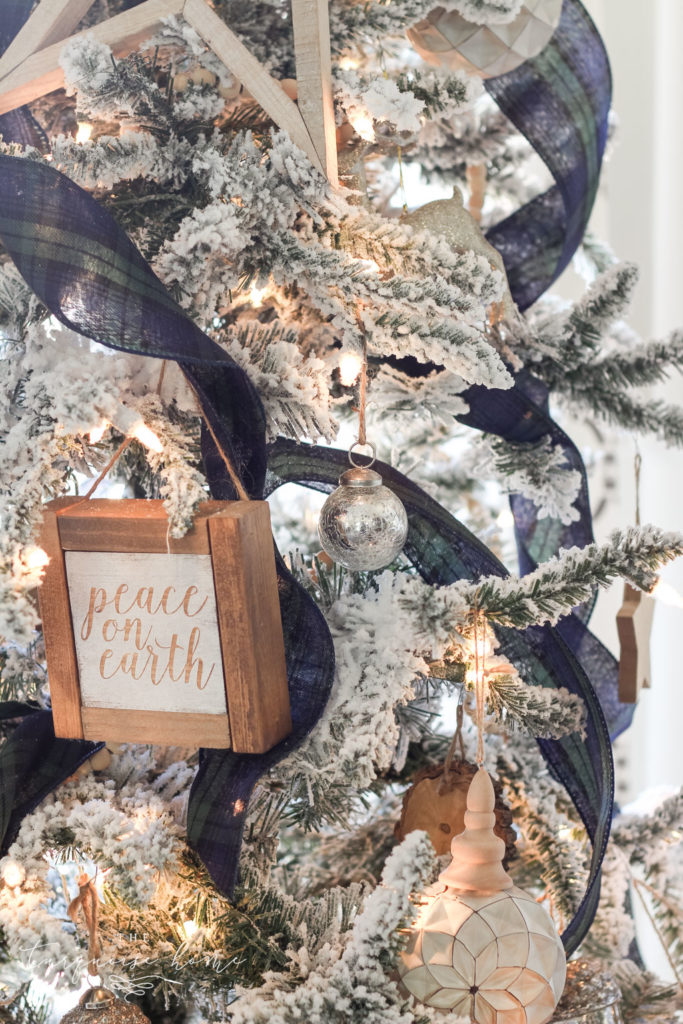 Blue and Green Plaid Ribbon on a Flocked Christmas Tree