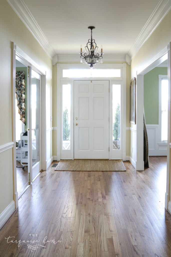 Entry way in new house with brown hardwood floors. 